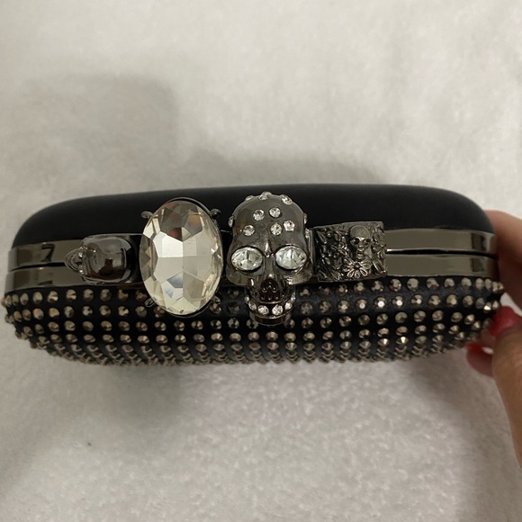 Skull Ring Knuckle Clutch with Chain Strap
McQueen inspired studded design - Picture 7 of 10